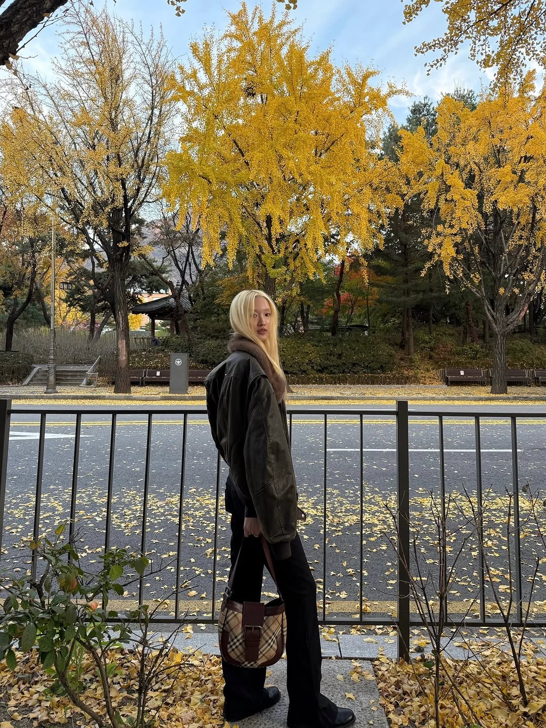 Photo shared by Yein on November 13, 2025 tagging @burberry. May be an image of park and text.