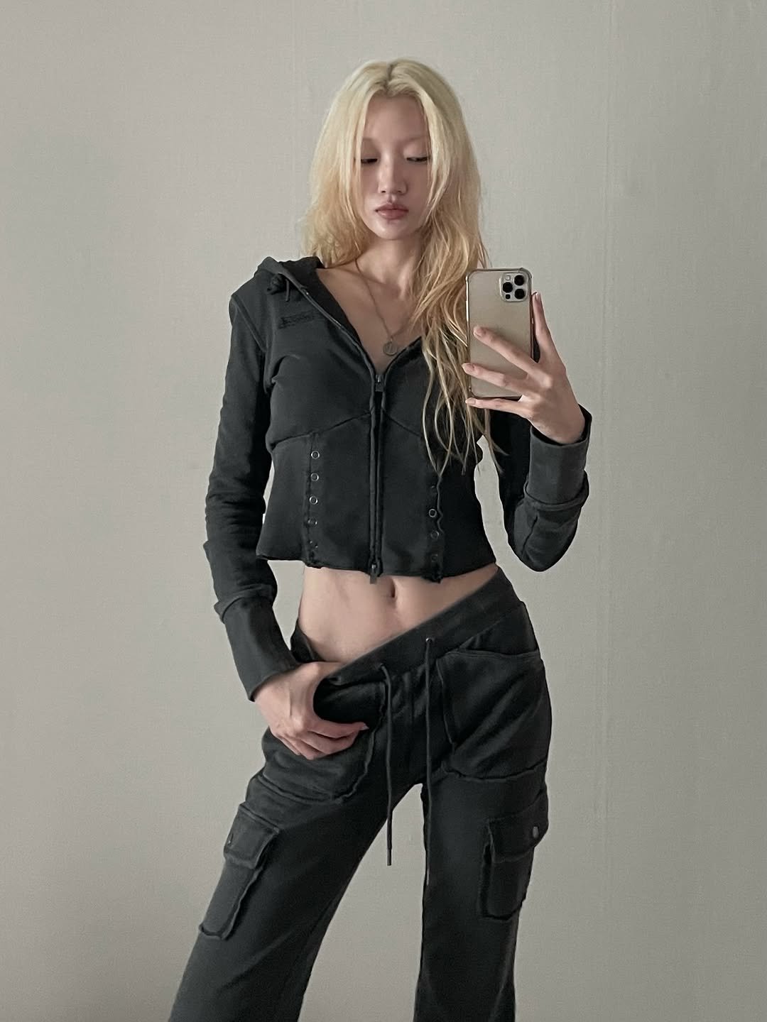 Photo shared by Yein on October 27, 2025 tagging @ordinaryholiday.official. May be an image of one or more people, blonde hair, activewear, sweatpants, parka, sportswear, drawstring and text.