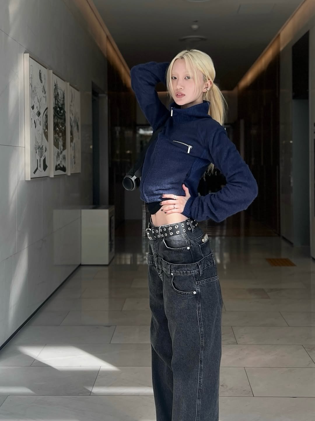 Photo shared by Yein on December 17, 2025 tagging @wet2ag. May be an image of one or more people, blonde hair, pants, turtleneck, sweatpants, sportswear and text.