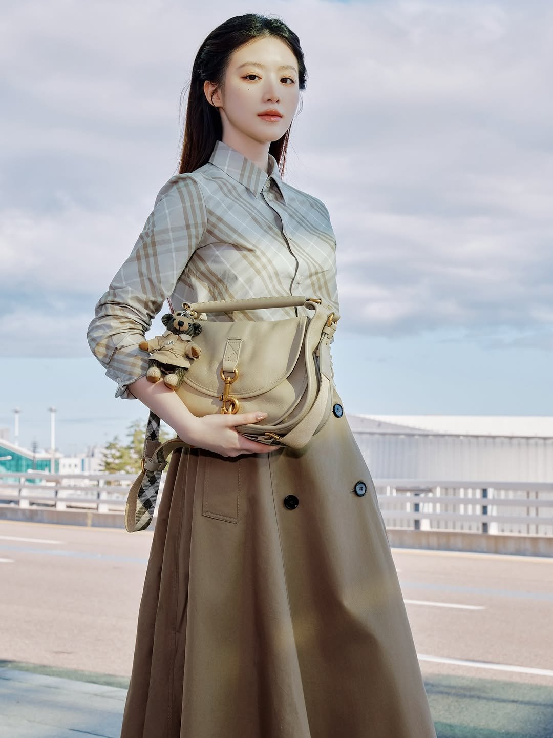 Photo shared by Shuhua on September 20, 2025 tagging @burberry. May be an image of 1 person, makeup, overcoat, duffle coat, dress and text.
