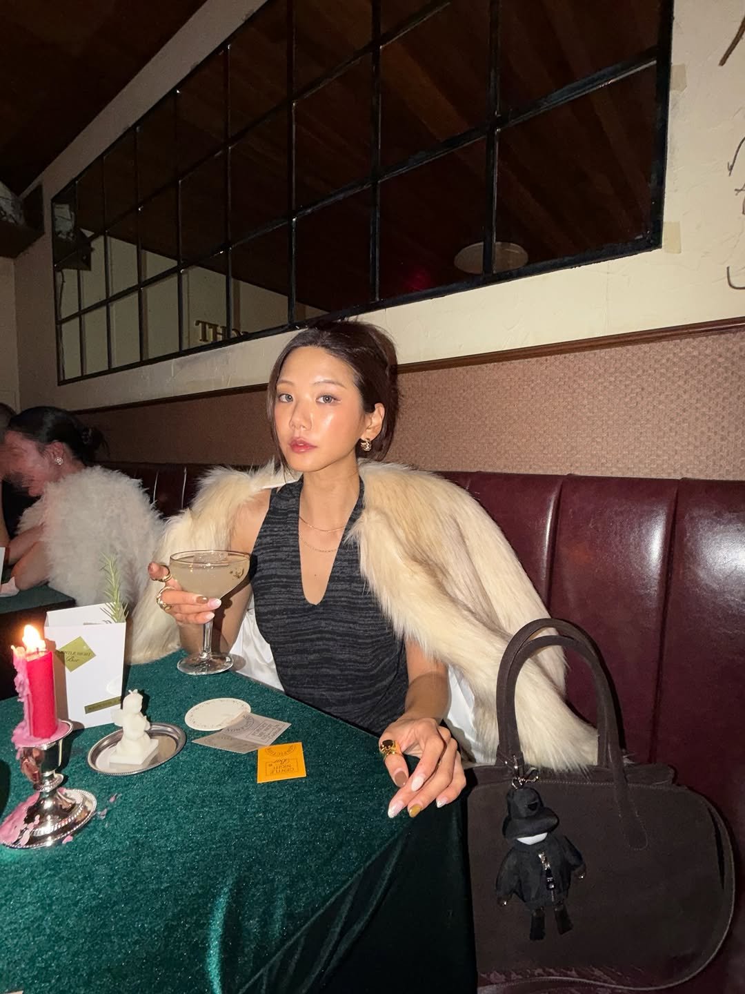 Photo shared by 예지 Yeji 🐿️ KIM on December 23, 2025 tagging @hillsandeuropa, and @official.nonfiction. May be an image of candle holder, fur coat and text.