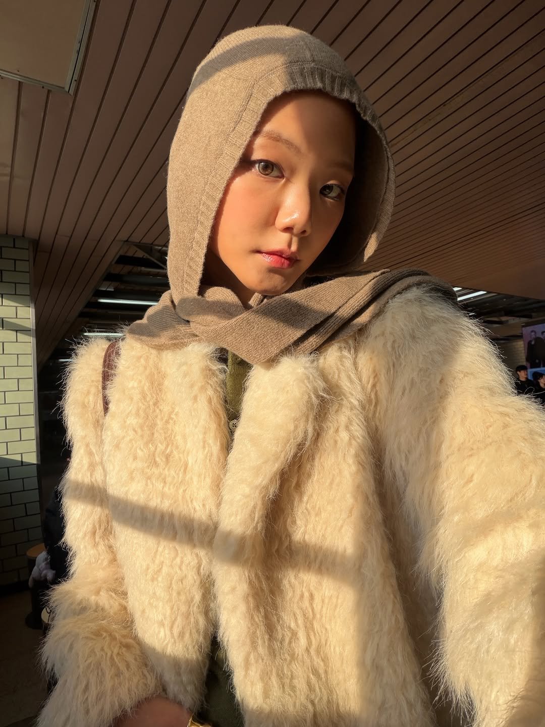Photo shared by 예지 Yeji 🐿️ KIM on December 18, 2025 tagging @sojeannekim, @leha.studio, and @donutvinylshop. May be an image of duffle coat, sable coat, goosedown coat, overcoat, cloak, parka and text.