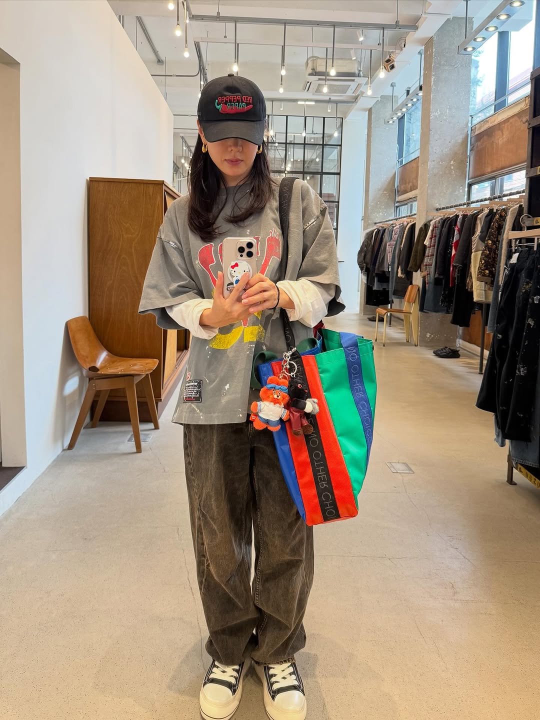 Photo by 손예진 on September 29, 2025. May be an image of duffle coat, hat, sling, grocery bag and text.