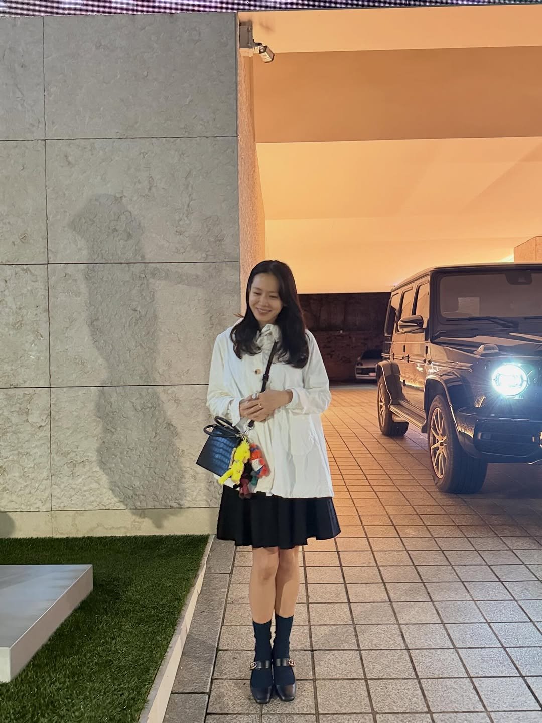 Photo by 손예진 on October 04, 2025. May be an image of 1 person, jeep, dress, outdoors and text.