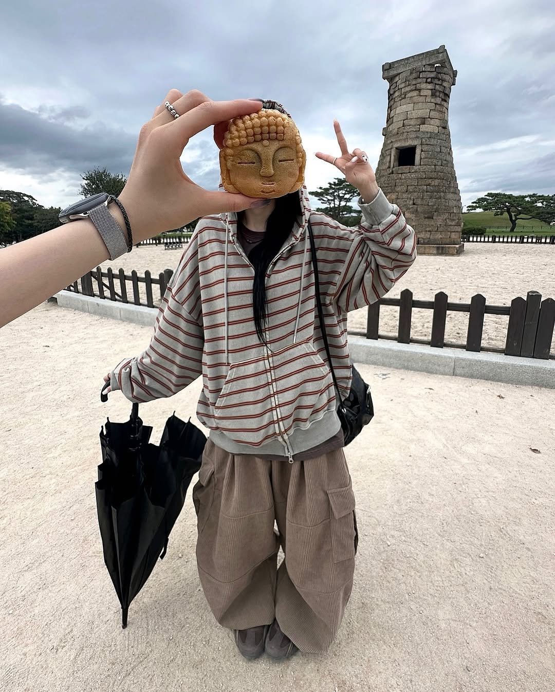 Photo by 오늘도 예모마일 :D on October 02, 2025. May be an image of 1 person, parasol, umbrella and text.