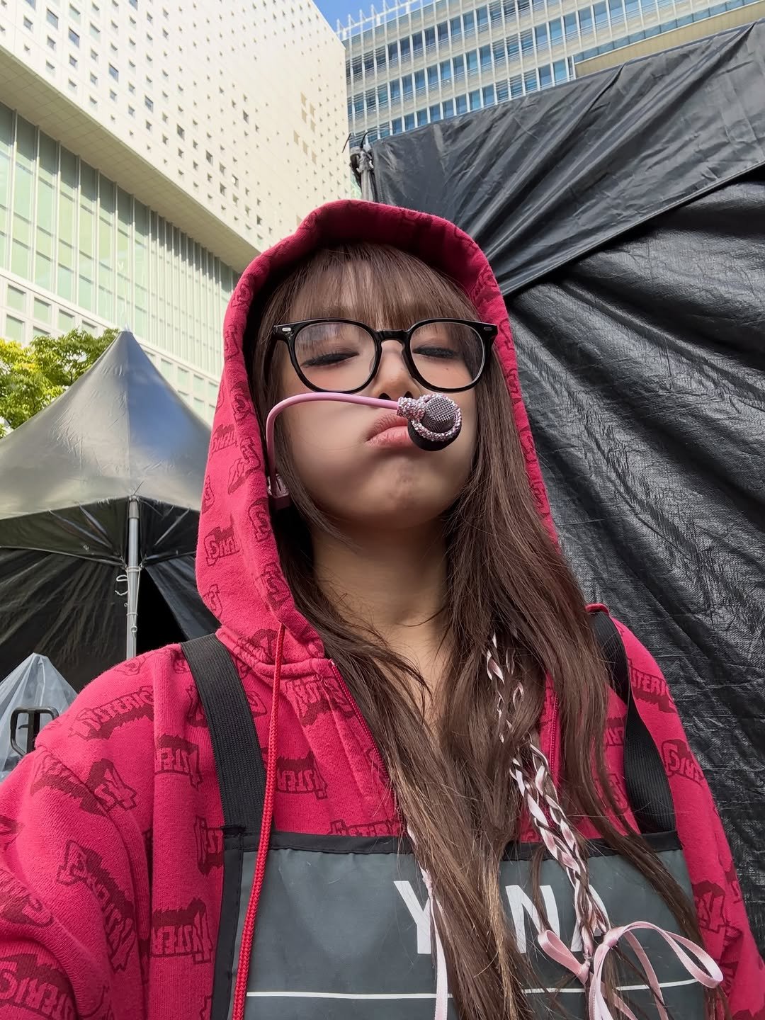 Photo by 최예나 on January 01, 2026. May be an image of cloak, umbrella, parka and text.