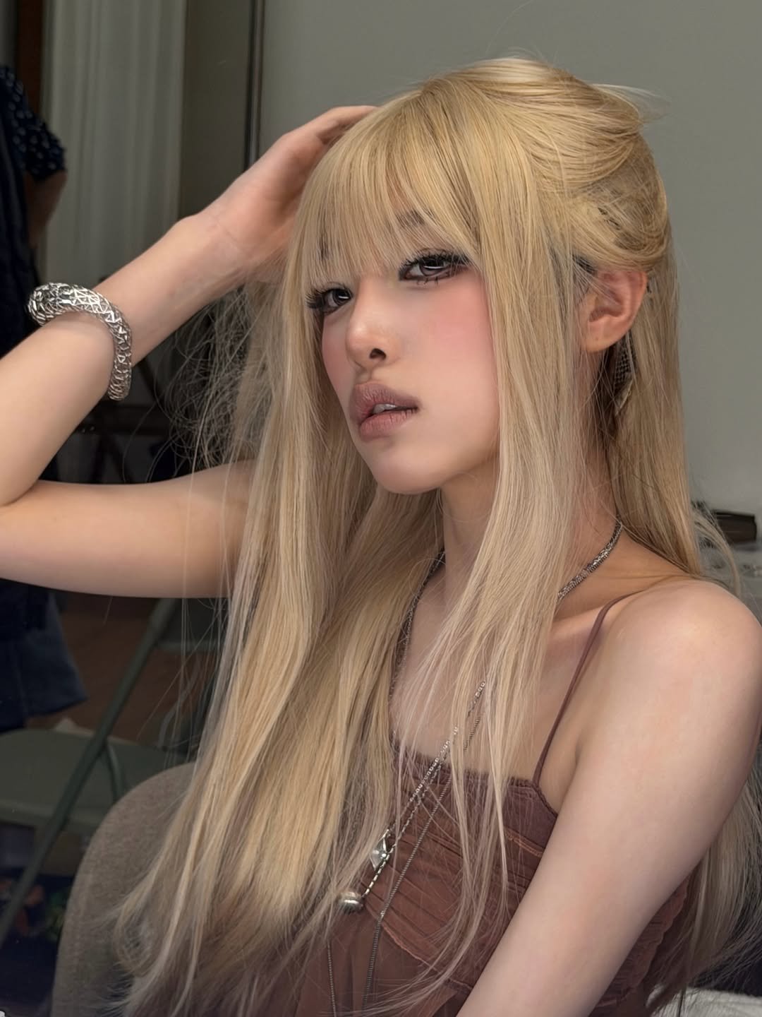 Photo by 최예나 on February 24, 2026. May be an image of one or more people, braids, blonde hair, makeup, costume and text.