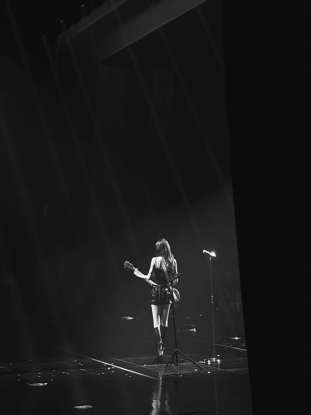 Photo by 최예나 on April 06, 2026. May be a black-and-white image of musical instrument, microphone, concert and text.