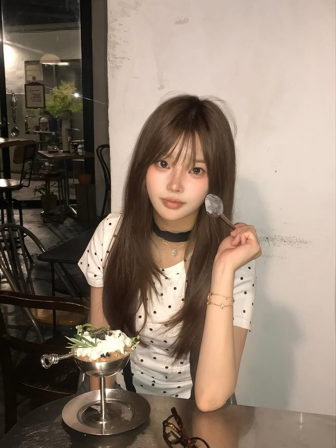 Photo by 연 on July 16, 2025. May be an image of 1 person, hair, choker, bolo tie, top and text.