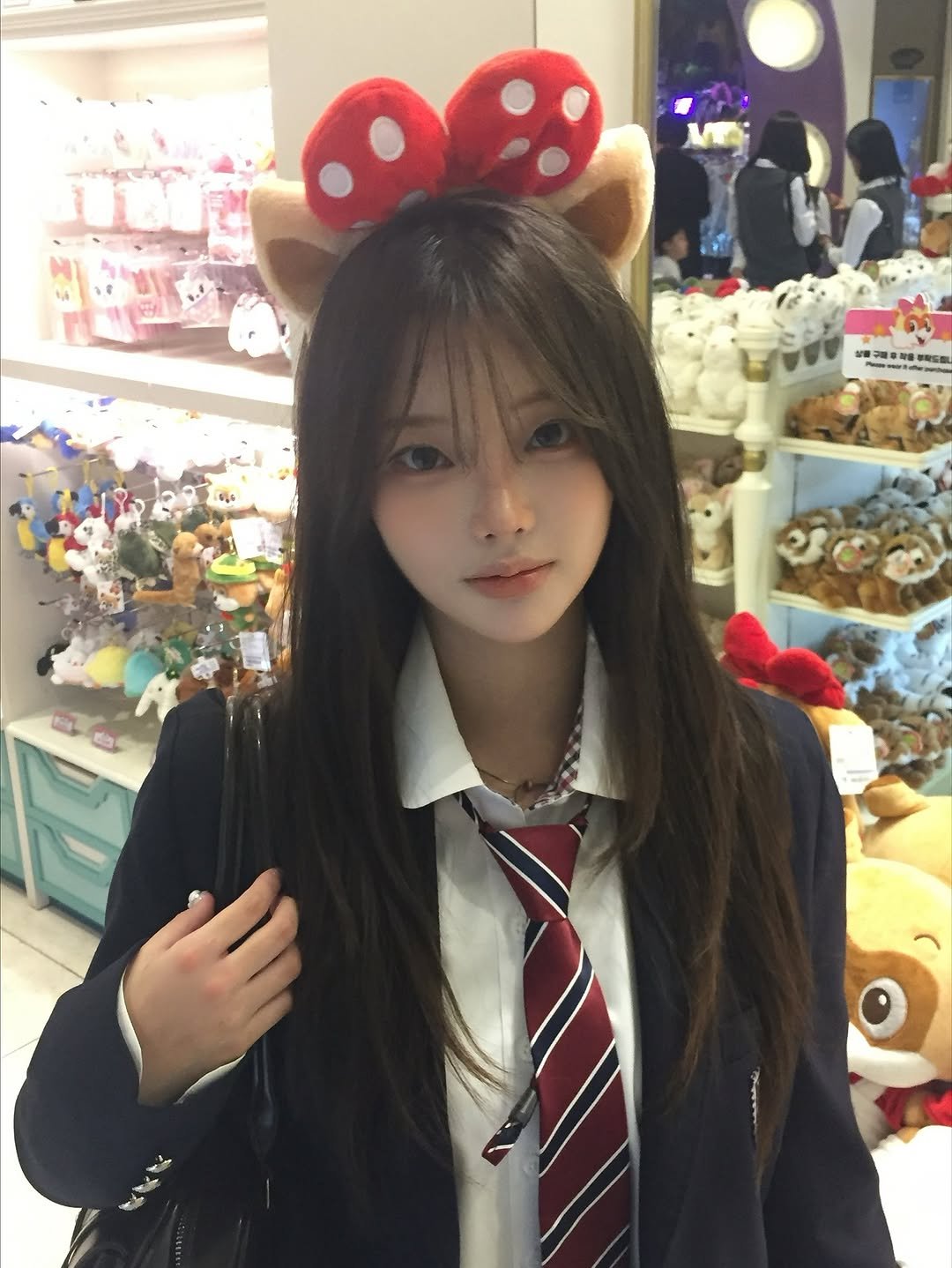 Photo shared by 연 on November 08, 2025 tagging @happylotteworld. May be an image of one or more people, hair, bow and text.