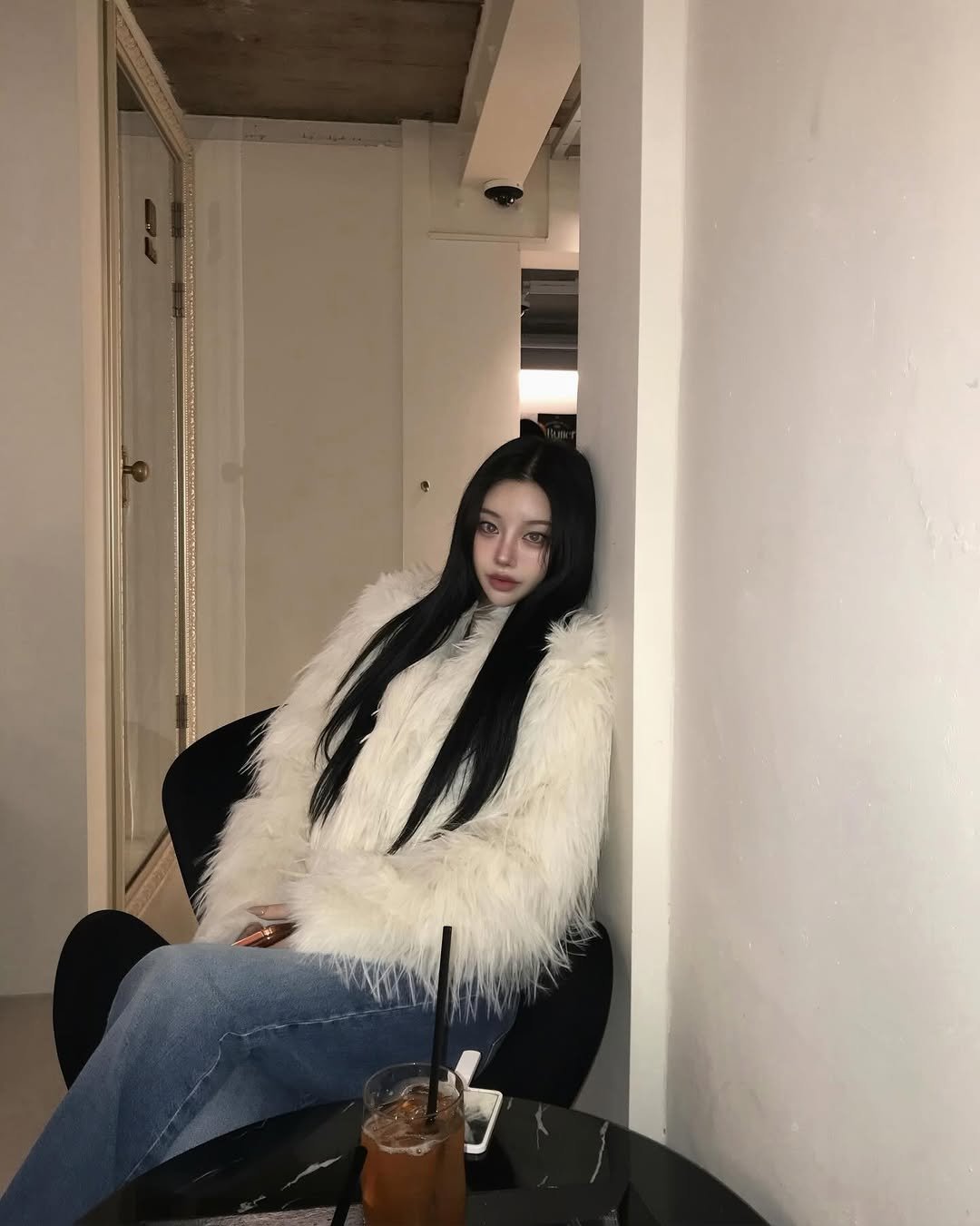 Photo shared by 선영 on January 12, 2026 tagging @aniv_official. May be an image of one or more people, hair, sable coat, duffle coat, goosedown coat, overcoat, parka, cornflower and text.