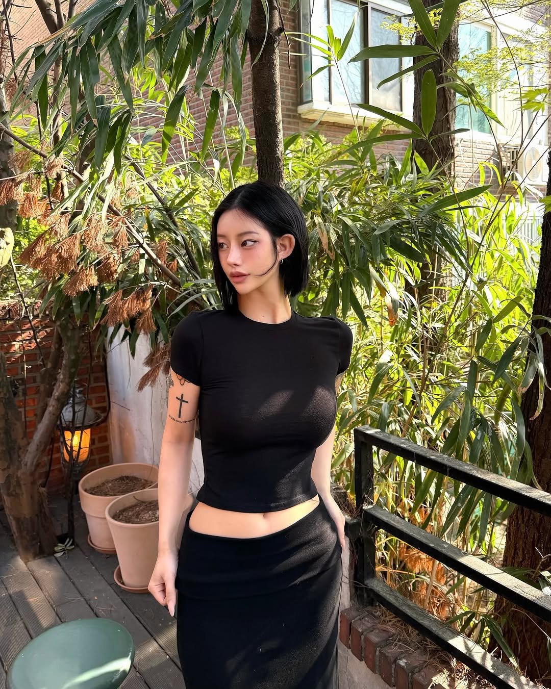 Photo by 선영 on April 07, 2026. May be an image of turtleneck, skirt, dress and text.