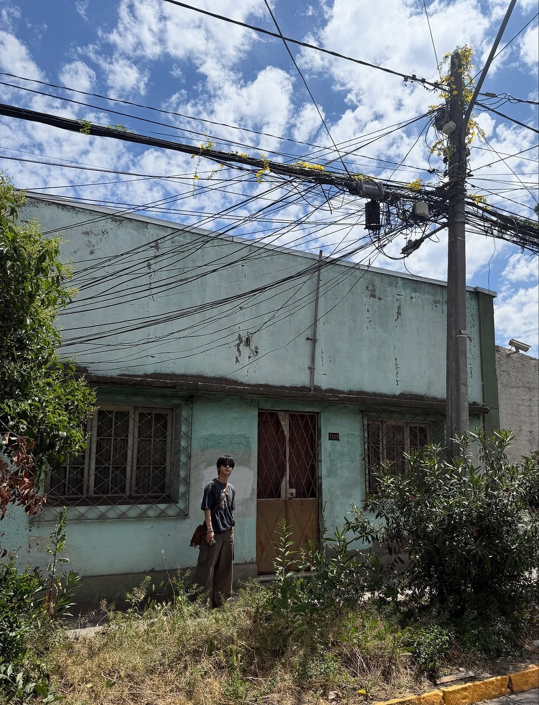 Photo shared by Yesung on October 19, 2025 tagging @yesung_smtown. May be an image of buildings, telephone pole and text.