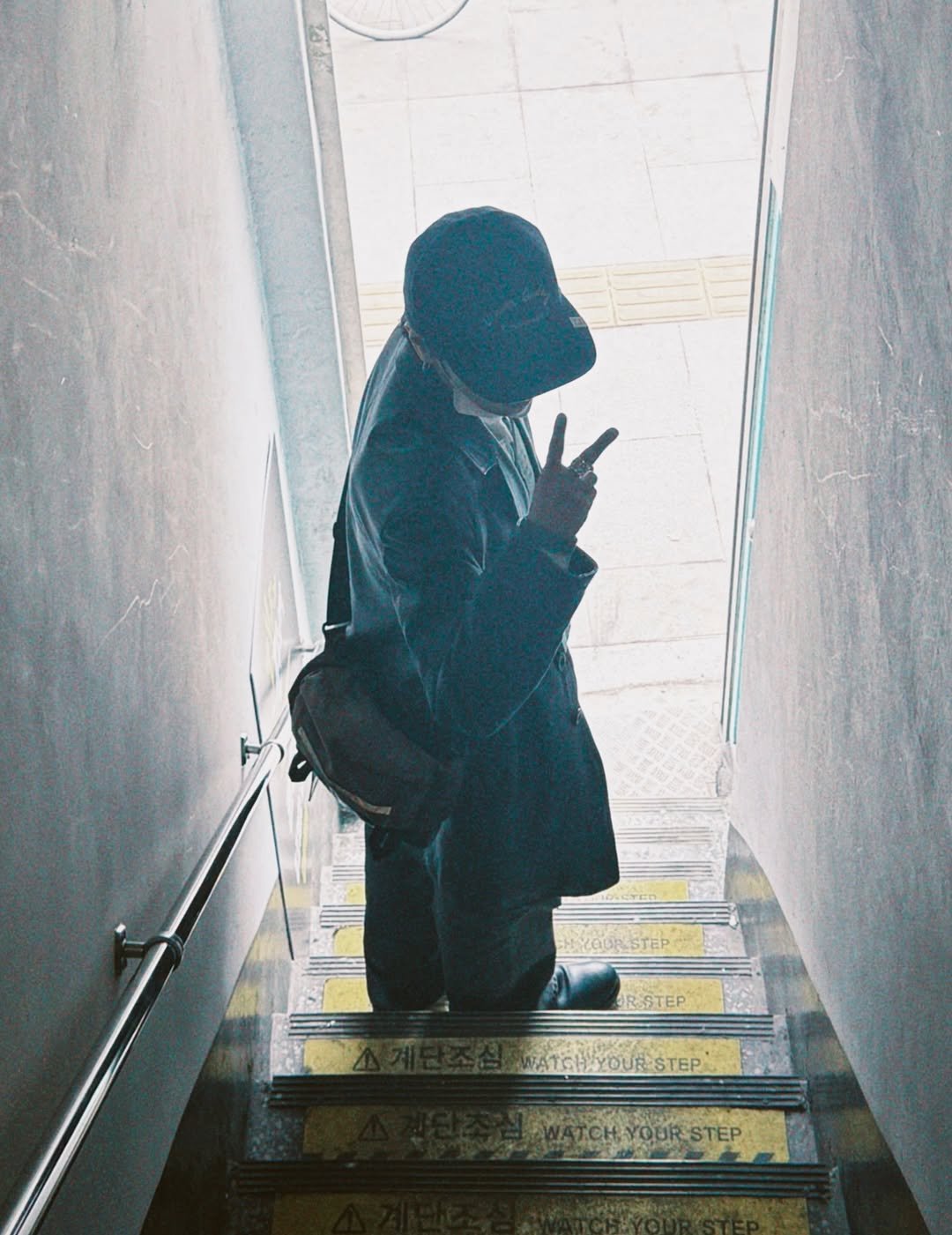 Photo shared by Yesung on March 18, 2026 tagging @yesung_smtown. May be an image of standing, duffle coat, overcoat, hat, face mask, parka, cloak, street and text.