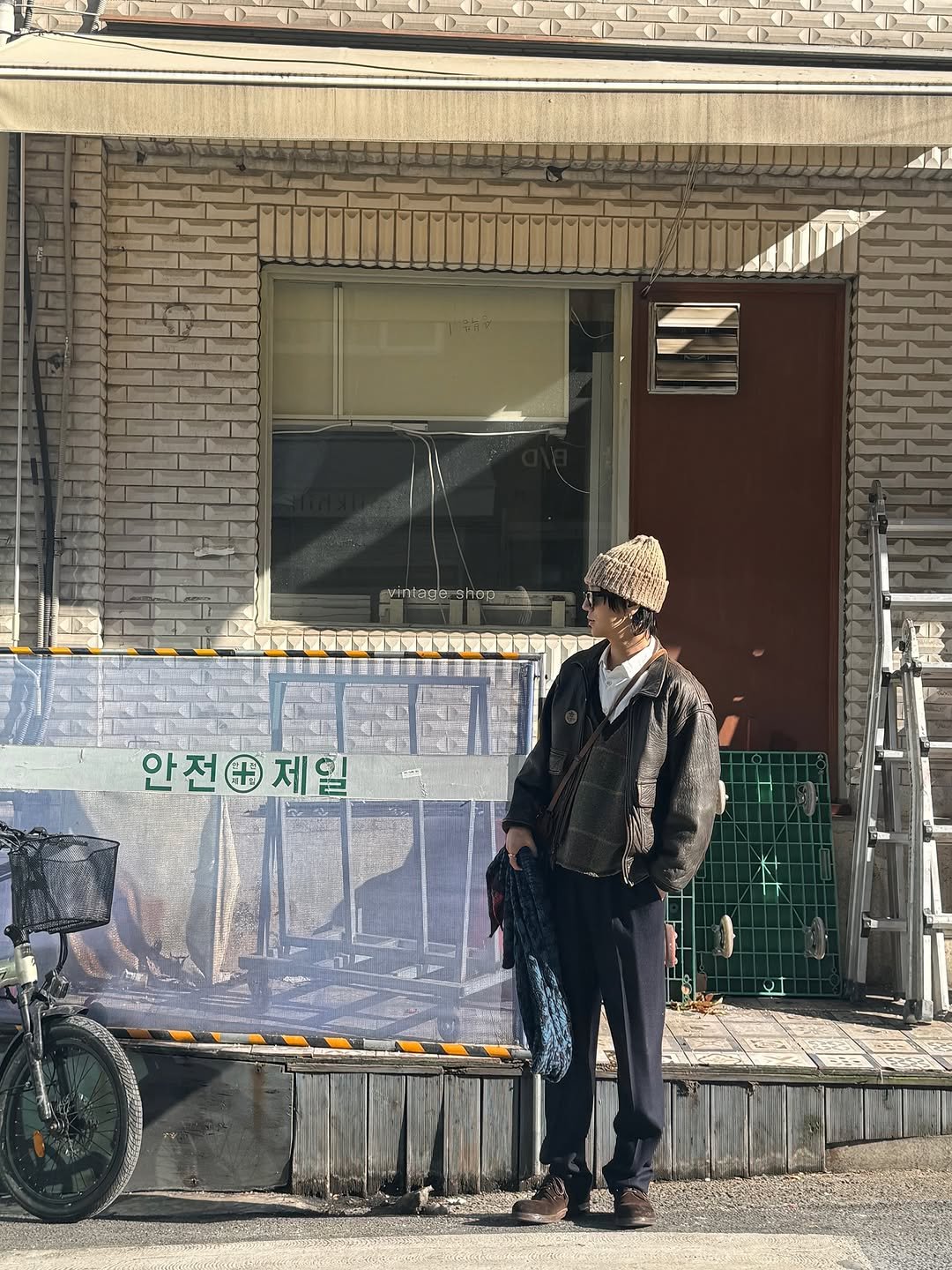 Photo shared by Yesung on February 14, 2026 tagging @yesung_smtown. May be an image of standing, bowler hat, street, curb and text that says '#t u B 雅'.