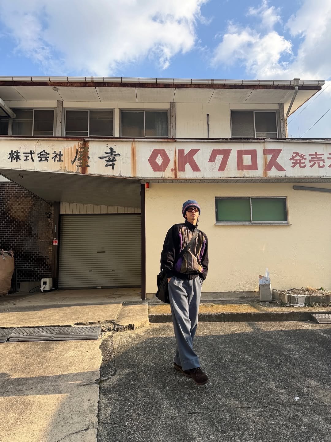 Photo shared by Yesung on February 01, 2026 tagging @yesung_jp_official. May be an image of cloud, street, buildings and text.