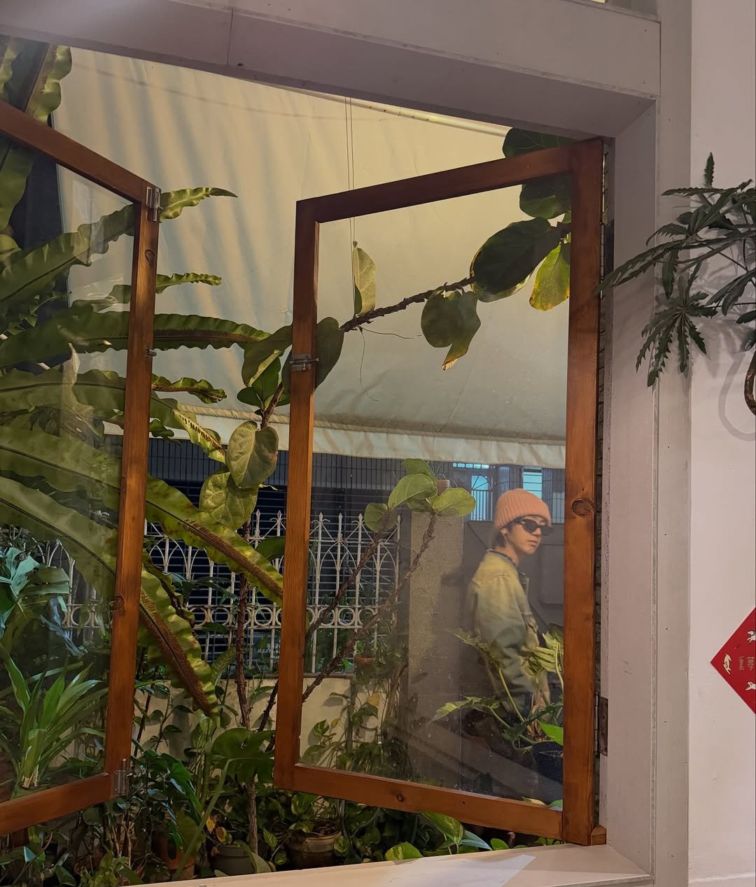 Photo shared by Yesung on January 22, 2026 tagging @yesung_smtown. May be an image of display case, sliding door, window and text.