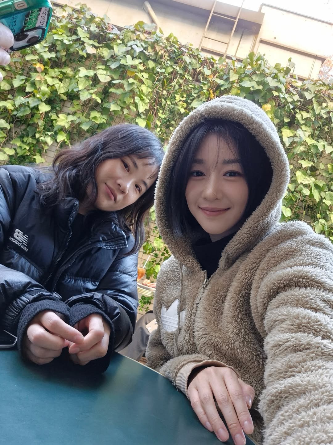 Photo by SEO YEA JI on November 17, 2025. May be a selfie of duffle coat, parka, jacket, fleece and text.