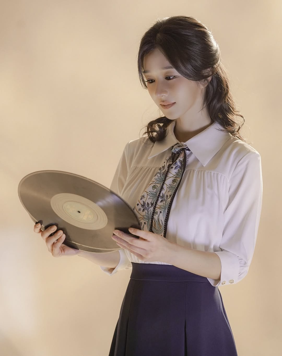 Photo by SEO YEA JI on January 27, 2026. May be an image of record player, record and text.