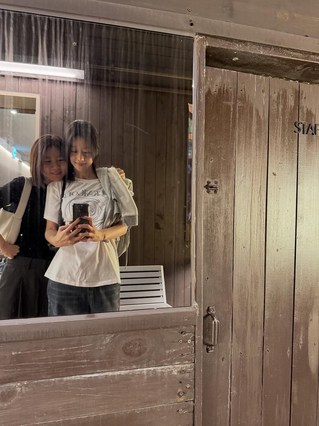 Photo shared by SEO YEA JI on September 26, 2025 tagging @veemil.j. May be an image of one or more people, mirror, door and text.