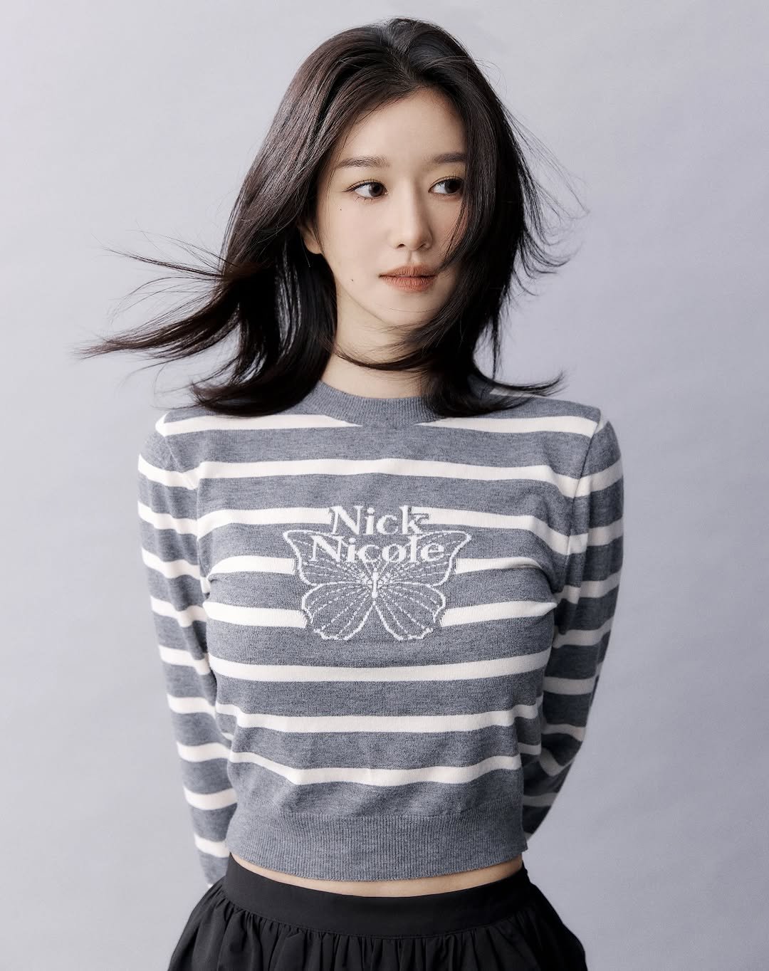 Photo by SEO YEA JI on October 25, 2025. May be an image of one or more people, hair, makeup, top, turtleneck and text.