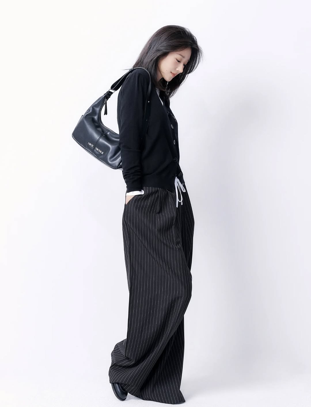 Photo by SEO YEA JI on November 03, 2025. May be an image of sweatpants, outerwear, drawstring and text.