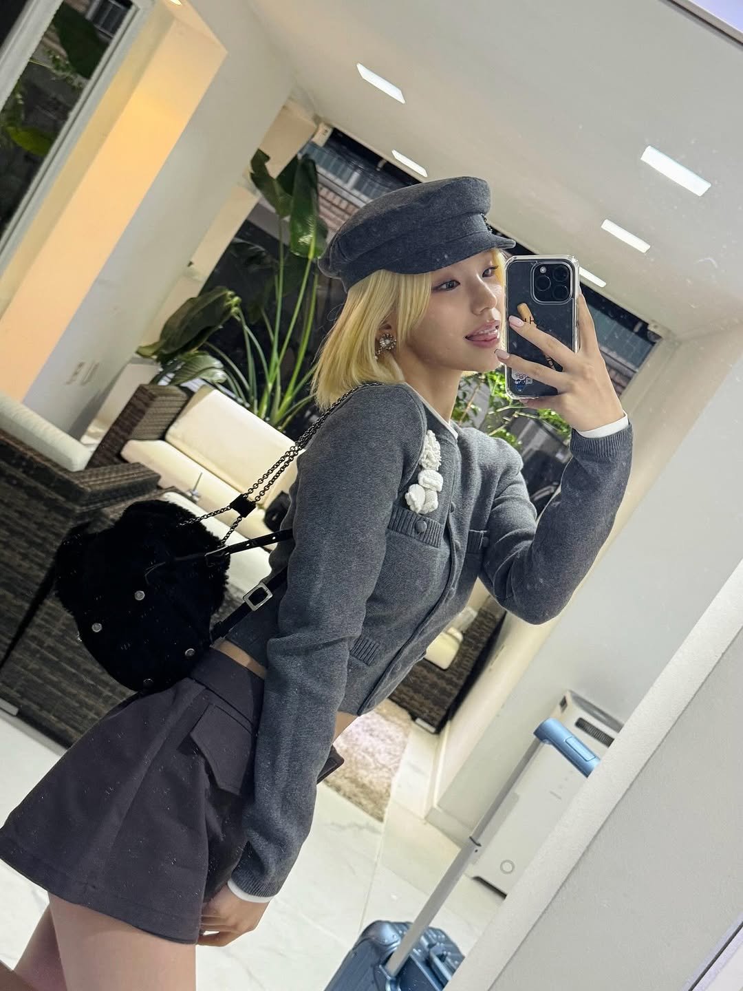 Photo by YEJI on September 30, 2025. May be a selfie of 1 person, blonde hair, top, beret, miniskirt, mirror and text.