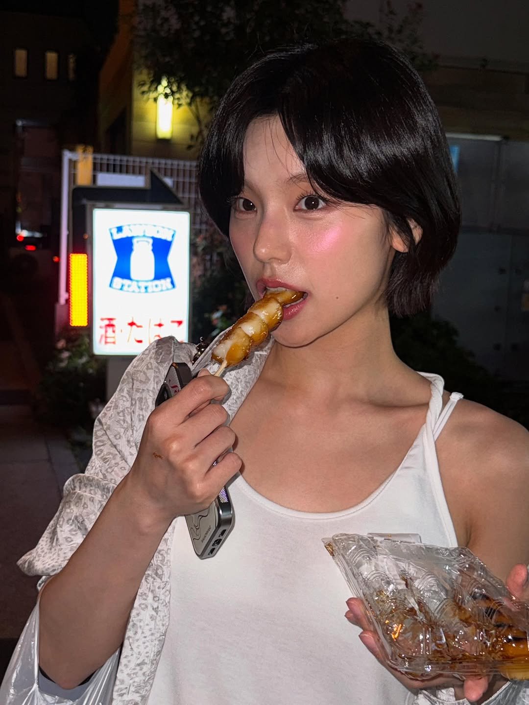 Photo by YEJI on July 12, 2025. May be an image of 1 person, smoking, ice cream, cigarette, cigar and text.