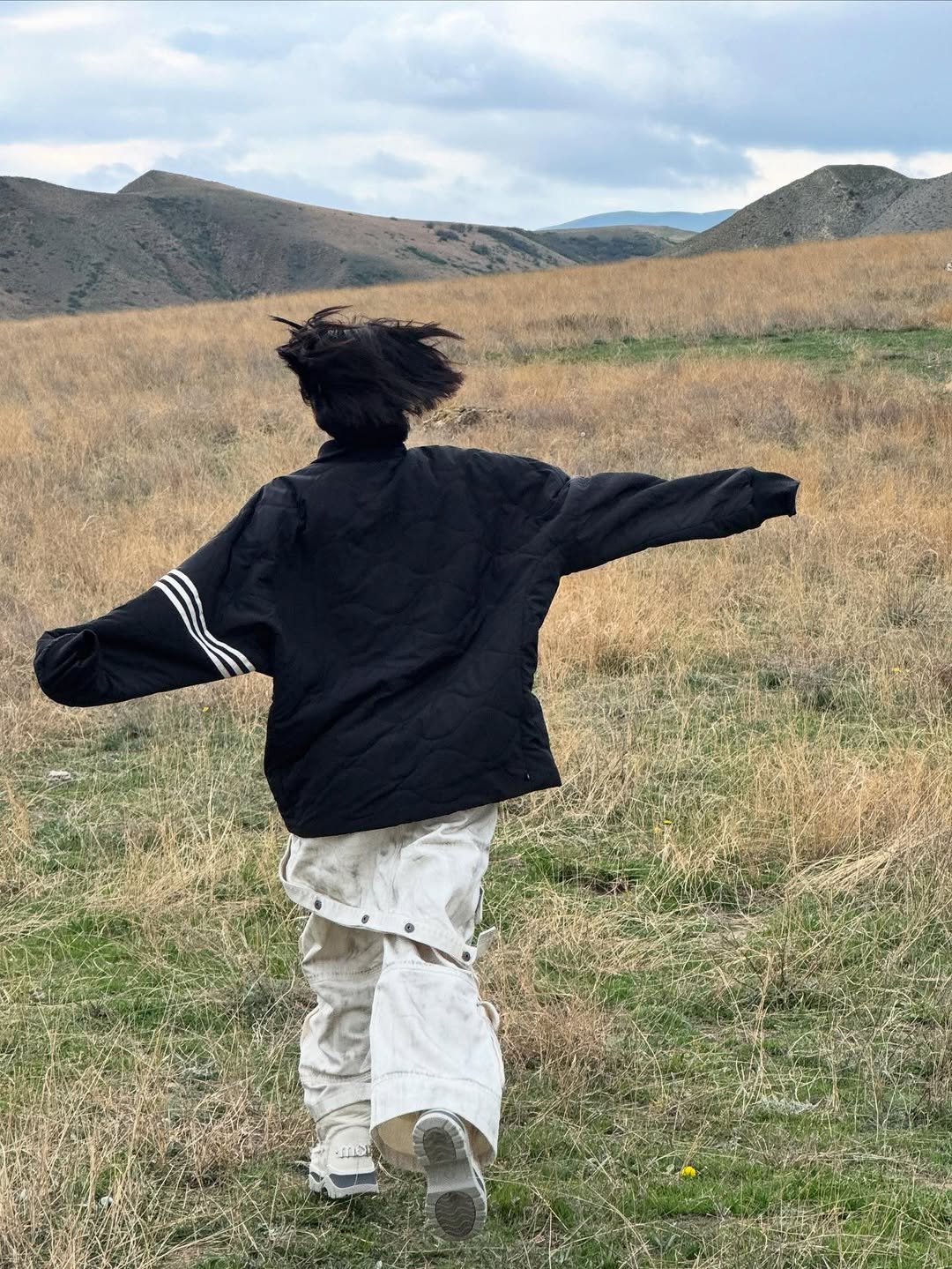 Photo by YEJI on June 12, 2025. May be an image of overcoat, raincoat, cloak and text.