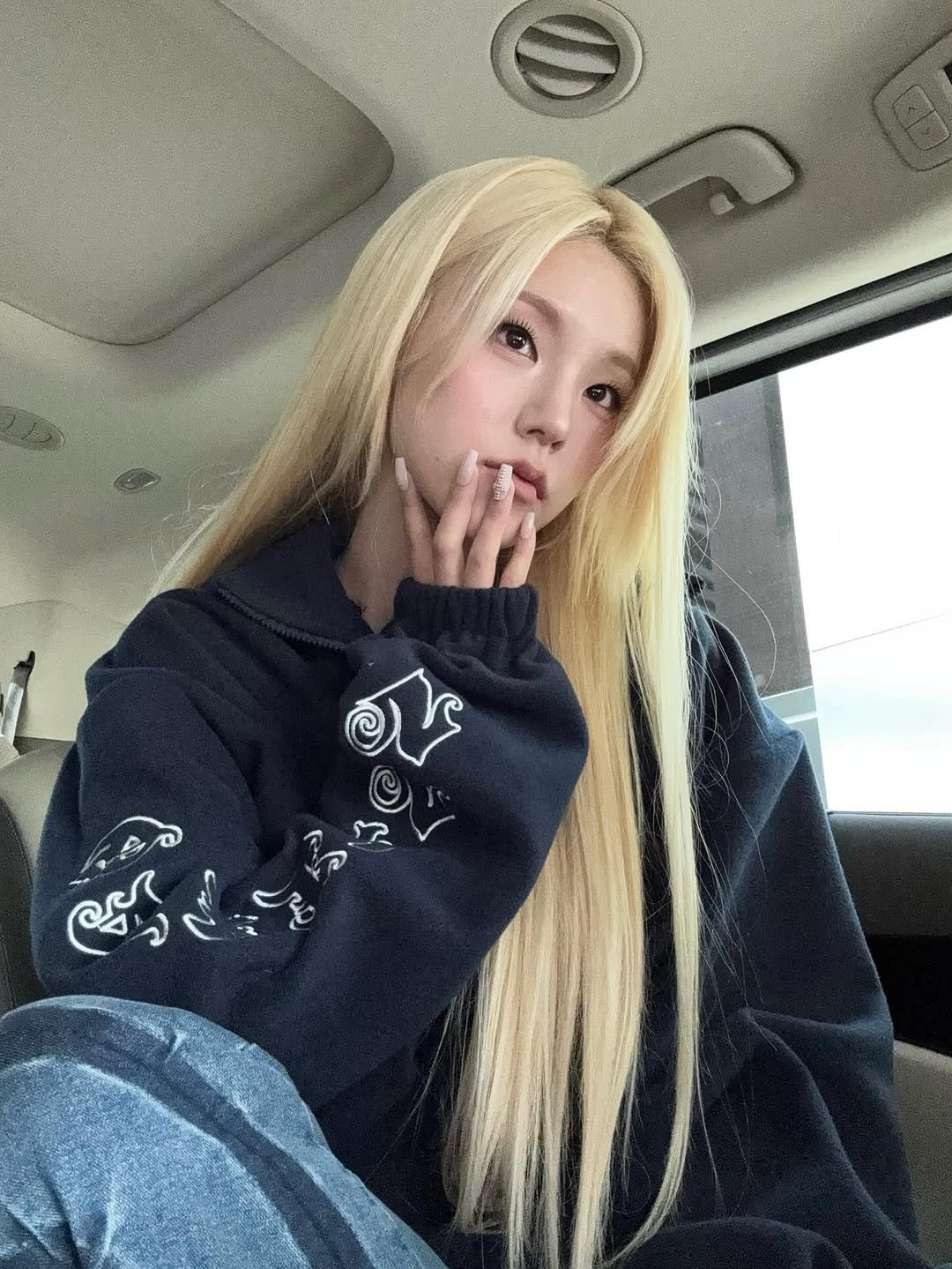 Photo by YEJI on November 05, 2025. May be an image of one or more people, blonde hair, makeup, top and text.