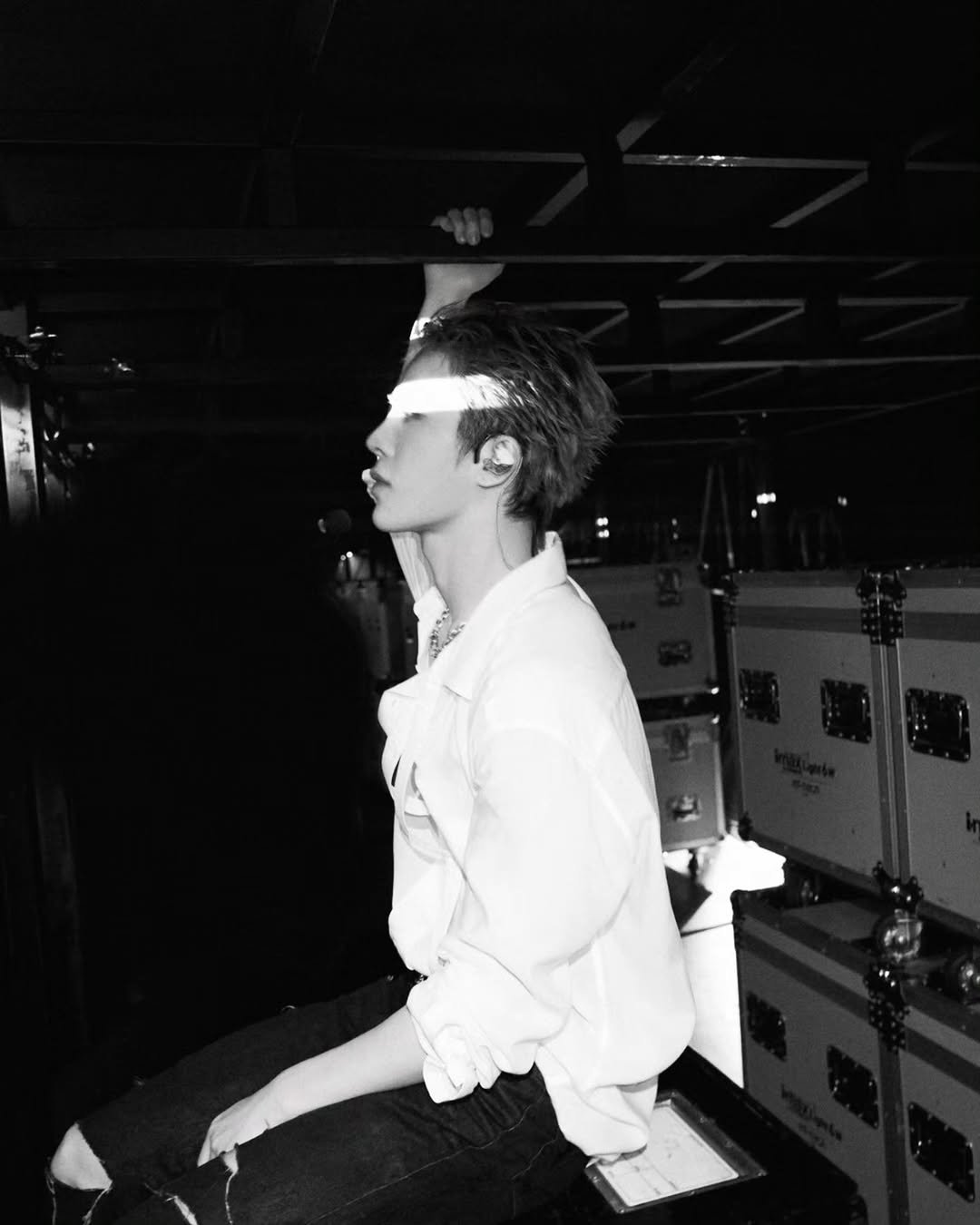 Photo by TREASURE (트레저) on November 21, 2025. May be a black-and-white image of one or more people, bangs, cigarette, top, bolo tie, concert and text.