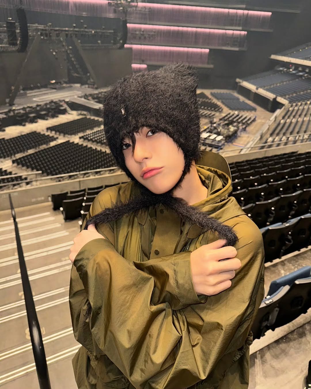 Photo by TREASURE (트레저) on November 24, 2025. May be an image of one or more people, bangs, parka, raincoat and text.