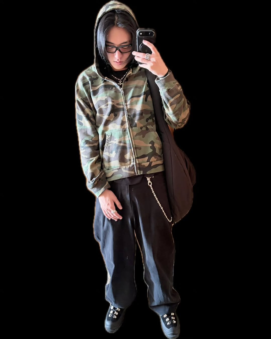 Photo by TREASURE (트레저) on November 21, 2025. May be an image of standing, military uniform, parka, sweatsuit, sweatpants and text.