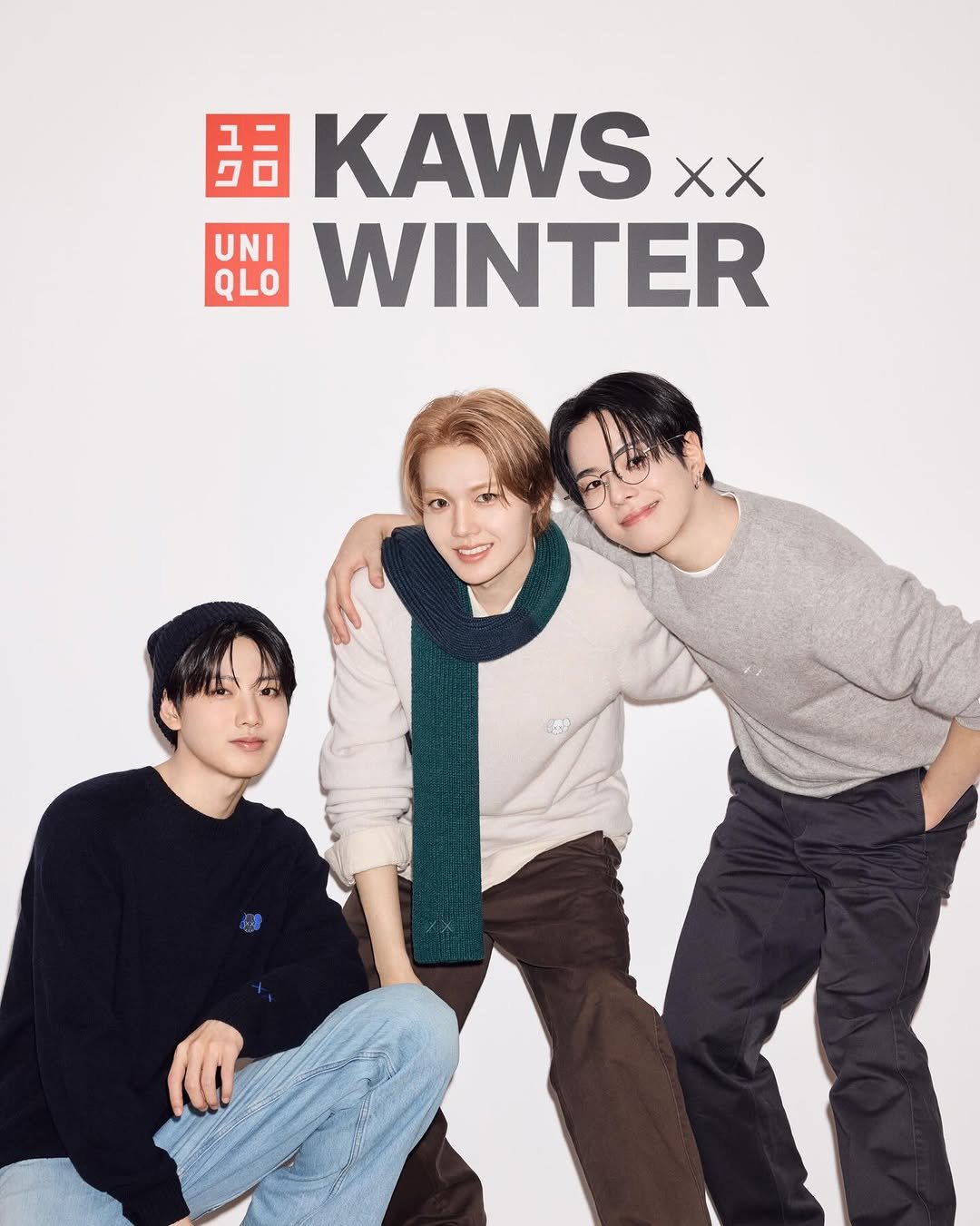 Photo shared by YG BIZ Official on November 24, 2025 tagging @yg_treasure_official, and @uniqlo_jp. May be an image of duffle coat, magazine, poster and text that says '品 KAWS XX UNI QLO WINTER'.