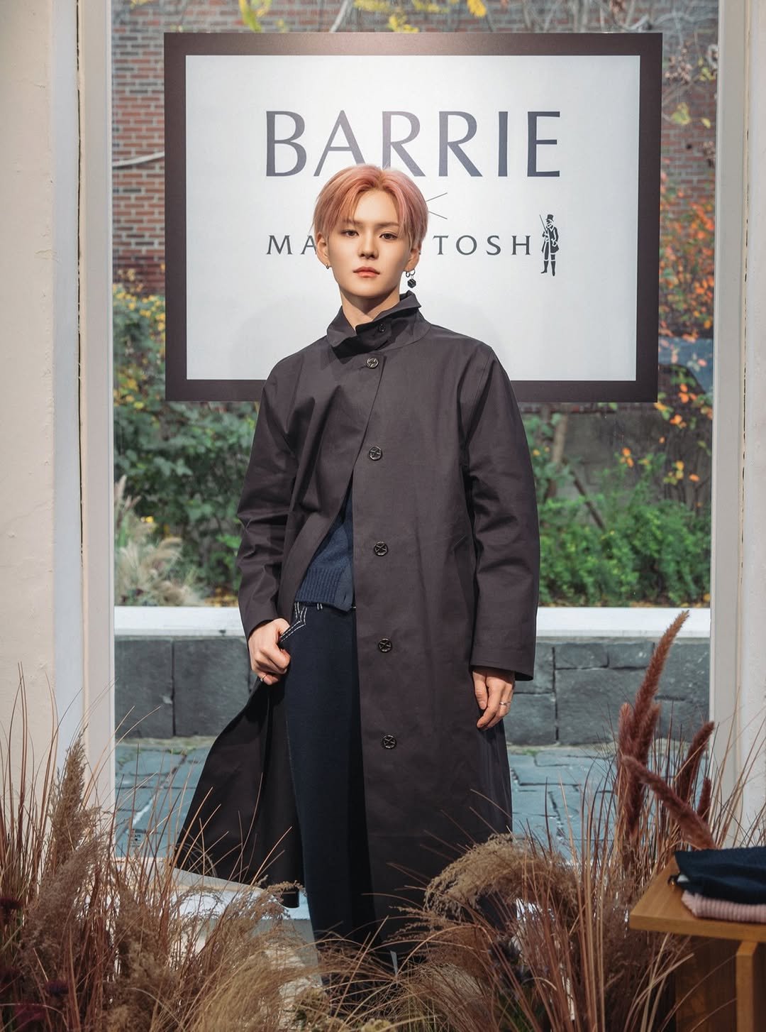 Photo shared by YG BIZ Official on November 16, 2025 tagging @barrie. May be an image of duffle coat, overcoat, turtleneck and text.