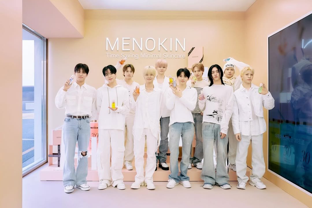 Photo shared by YG BIZ Official on November 27, 2025 tagging @yg_treasure_official, and @menokin_official. May be an image of one or more people, bangs, poster and text that says 'MENOKIN, Time Saving Minimal Skincare imeSavingMinimalSkincare LRORN SAJNE SSIn S 1930 21'.