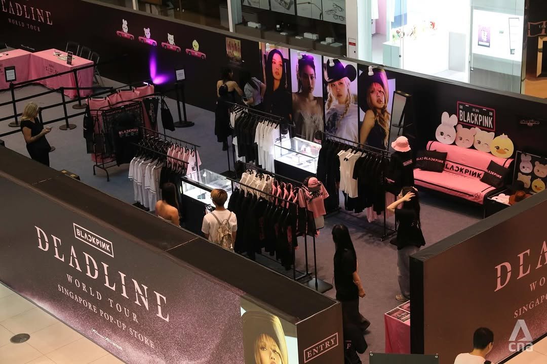 Photo shared by Merch Traffic on November 25, 2025 tagging @ygselect, and @livenationsg. May be an image of one or more people, makeup, display case and text that says 'E BLACKPINK LADEPINE ИK A3KPИK 3KFIHK BLADLINT PLABANE BLAKPINY BLACKPINK SINGAPOREPOR-UPSY SINGAPORE WORLD POP-UP WORLDTOUR POY TOUR STORE DC A cna'.