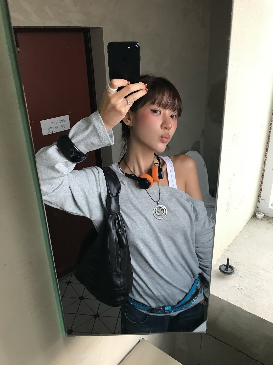 Photo shared by 혜지투즈 on September 18, 2025 tagging @dkstorekr. May be a selfie of 1 person, bangs, phone, top, mirror, turtleneck and text.