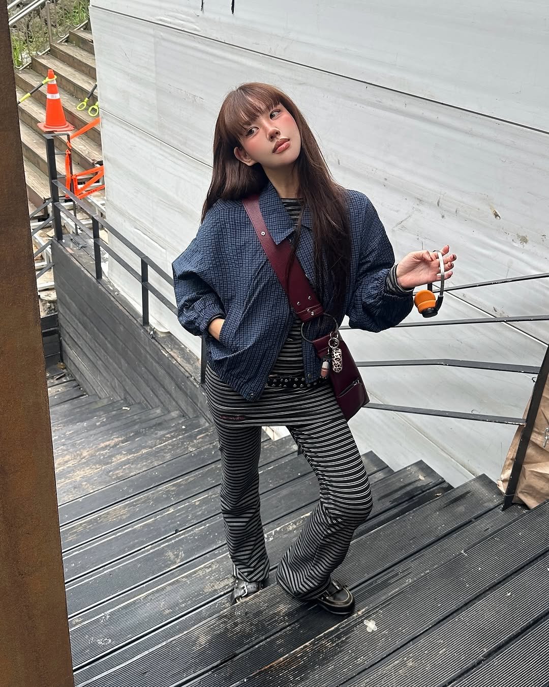 Photo shared by 혜지투즈 on September 28, 2025 tagging @menasoo.official. May be an image of 1 person, hair, parka, coat, fishnet stockings and text.