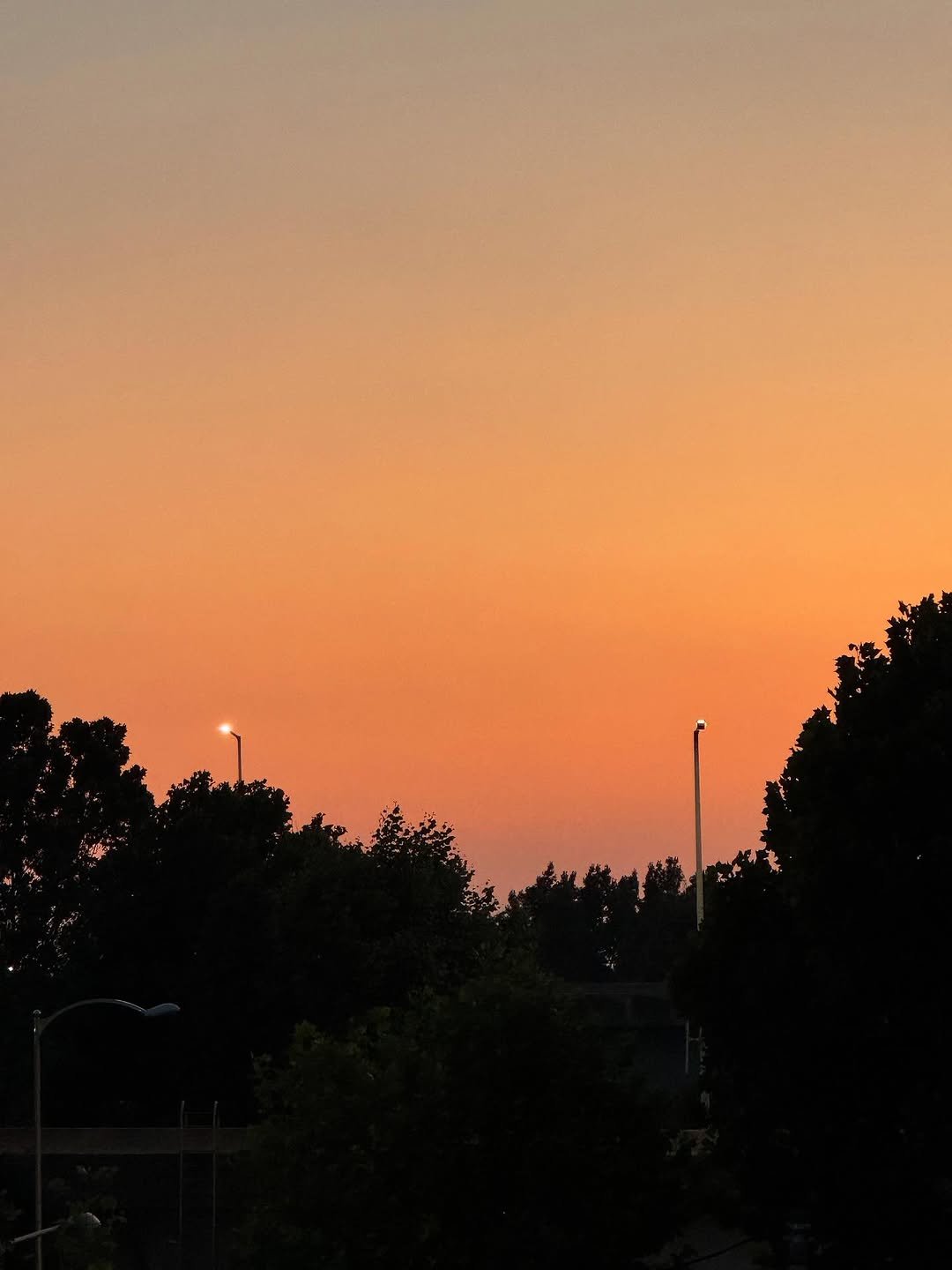 Photo by 김민철 on July 02, 2025. May be an image of eclipse, twilight, horizon, sky, lamppost, telephone pole and text.