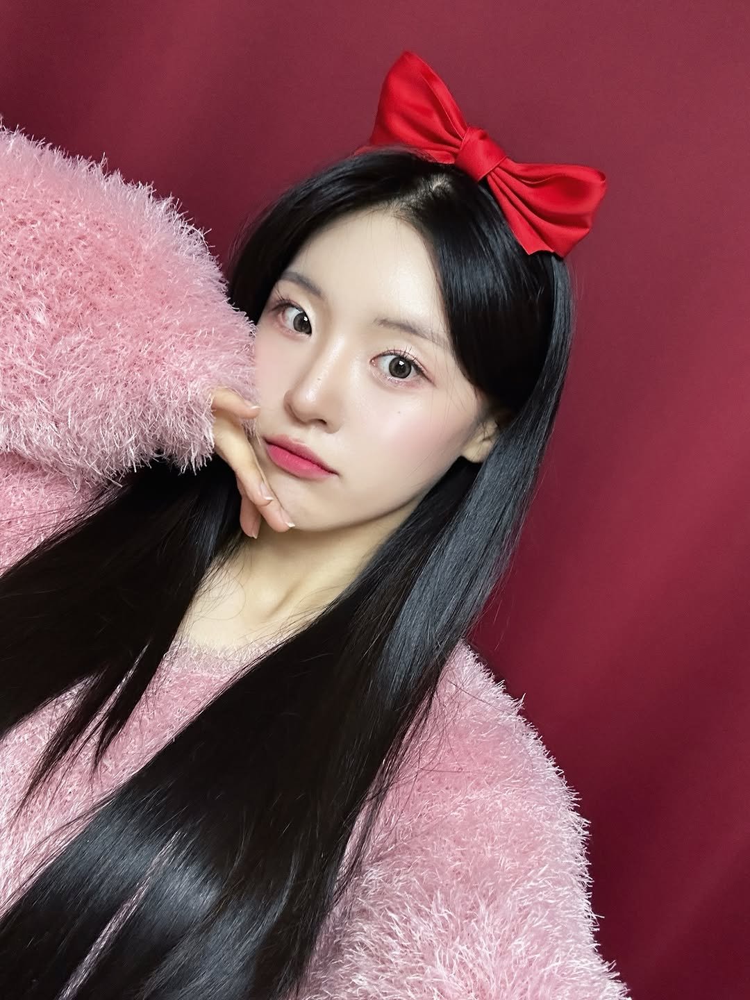 Photo by 채효령 on December 30, 2025. May be an image of one or more people, braids, makeup, bow and text.