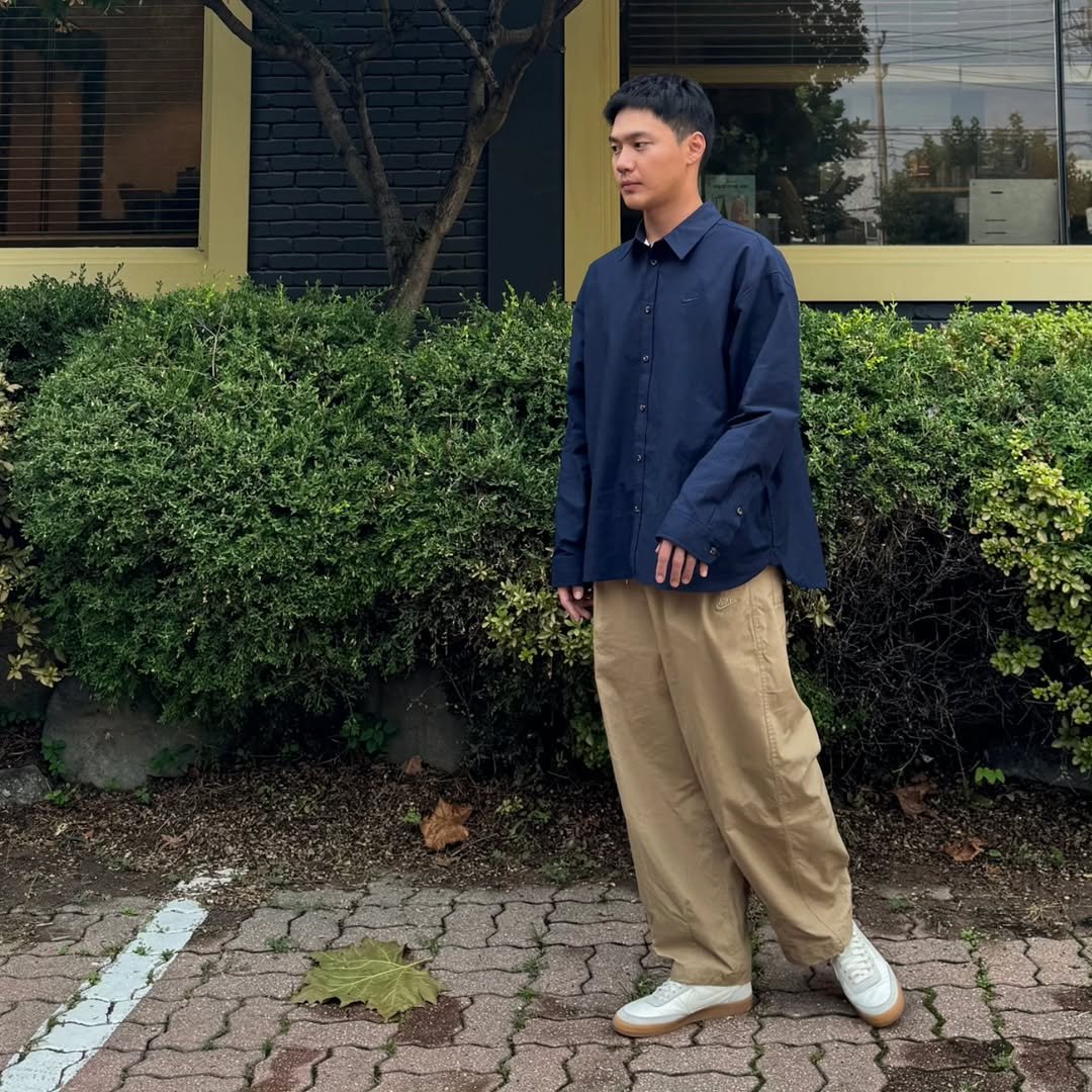 Photo shared by 요가지몽 on September 20, 2025 tagging @nikeseoul. May be an image of 1 person, duffle coat, parka and text.
