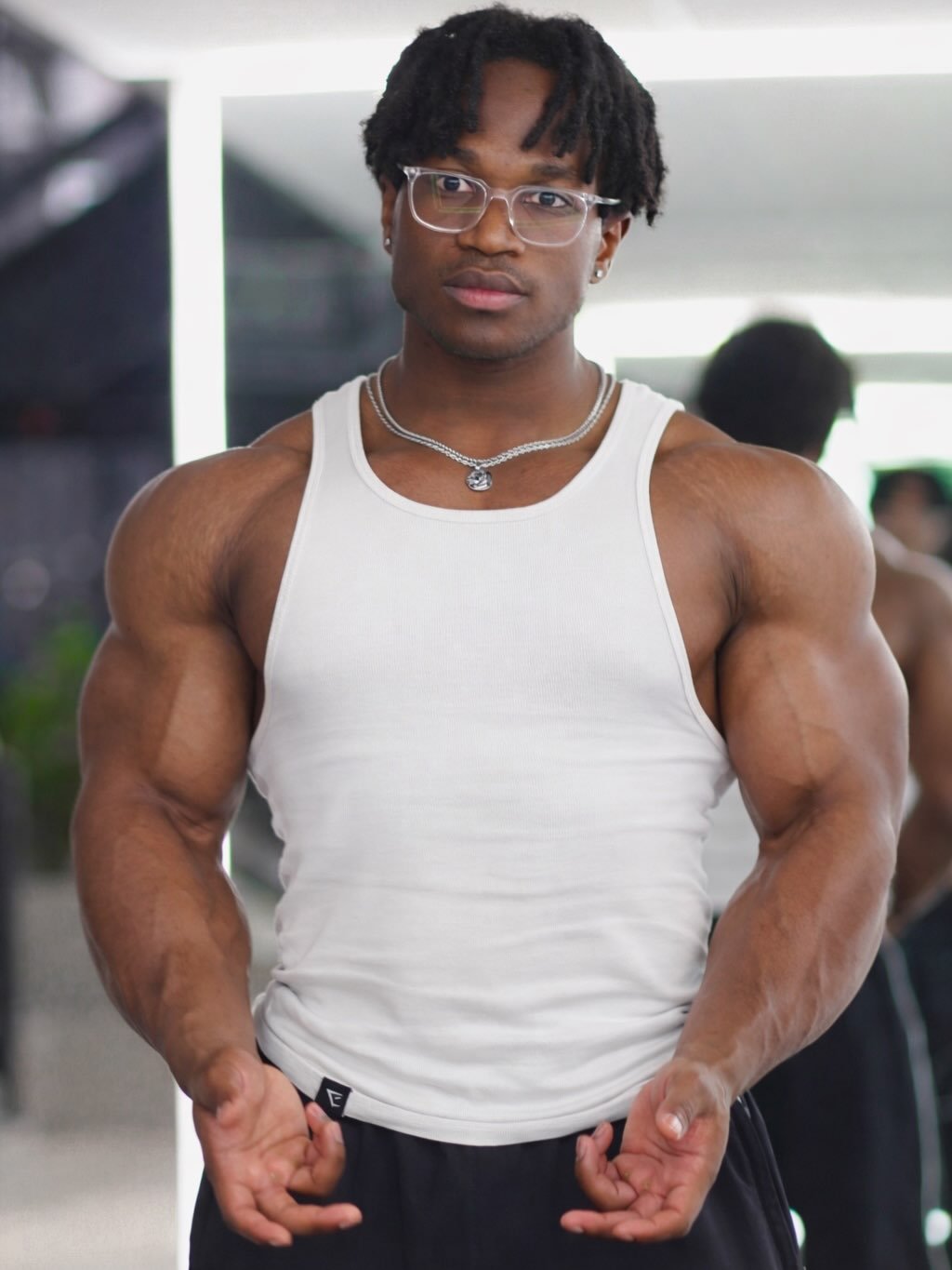 Photo by Jeremy koko on December 23, 2025. May be an image of one or more people, biceps, people bodybuilding and text.