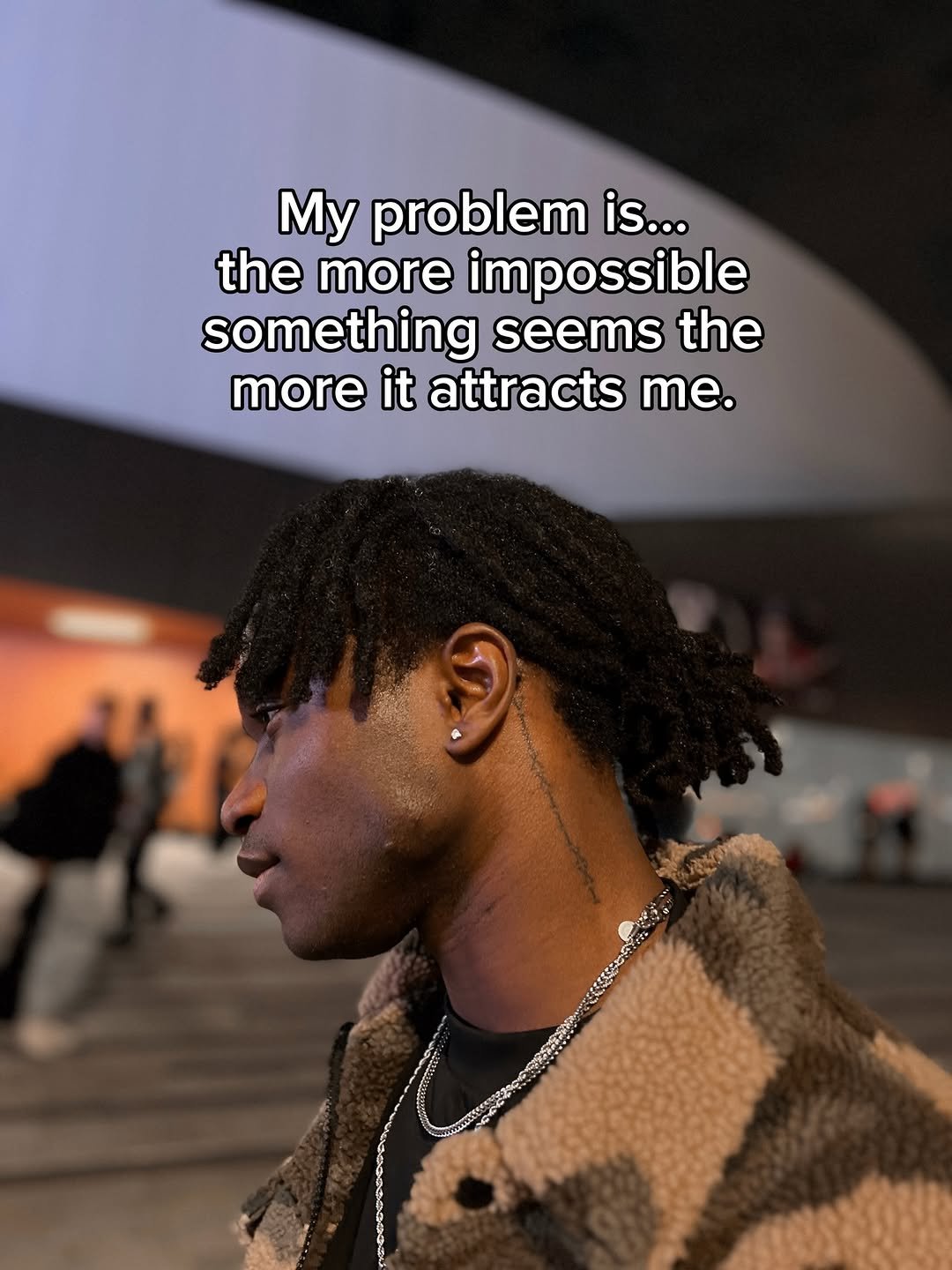 Photo by Jeremy koko on February 13, 2026. May be a graphic of one or more people, people standing, poster and text that says 'My problem is... the more impossible something seems the more it attracts me.'.