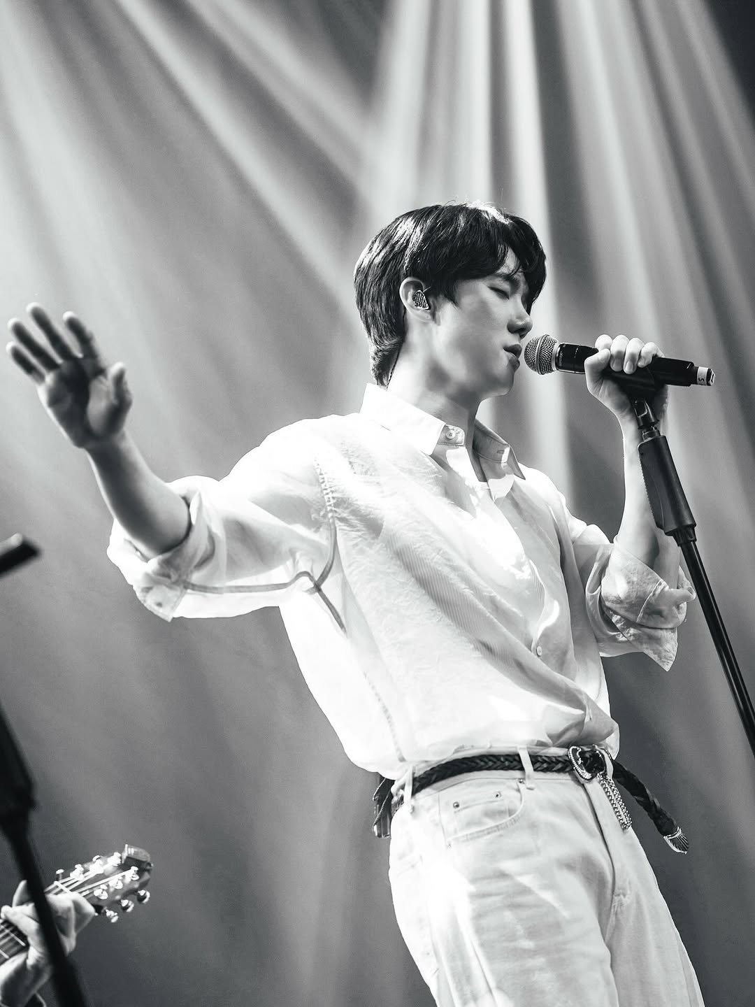 Photo by 유연석 on December 29, 2025. May be a black-and-white image of one or more people, bangs, top, bolo tie, concert and text.