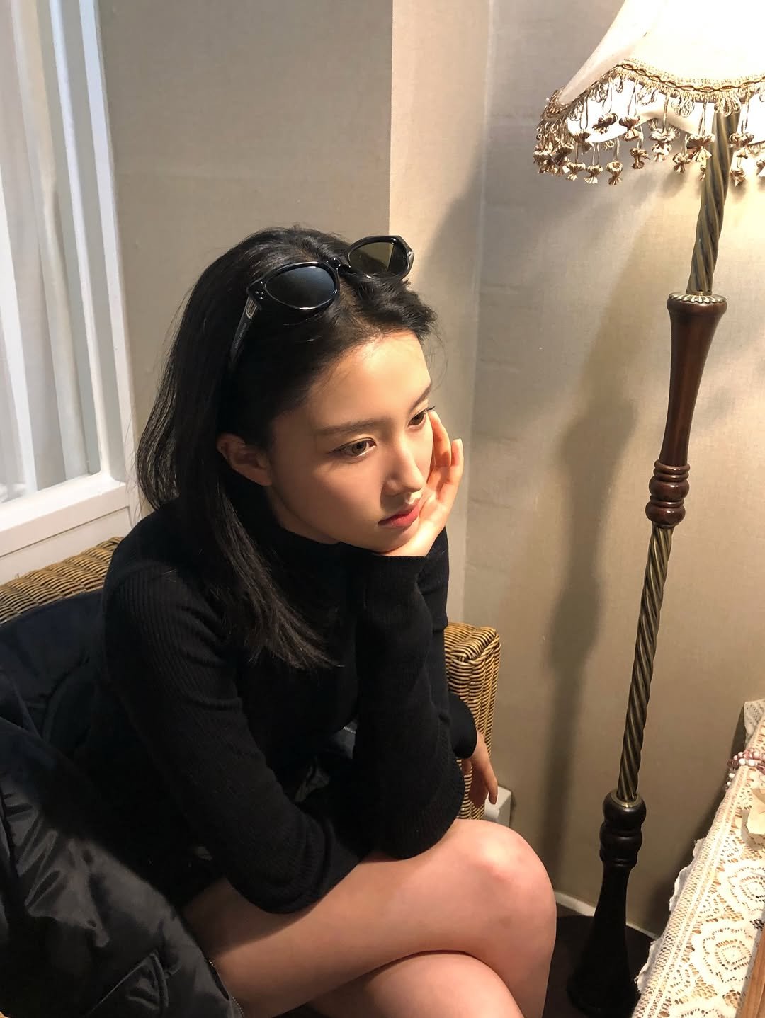 Photo by 심자윤 on March 18, 2026. May be an image of eyewear, turtleneck, miniskirt and text.