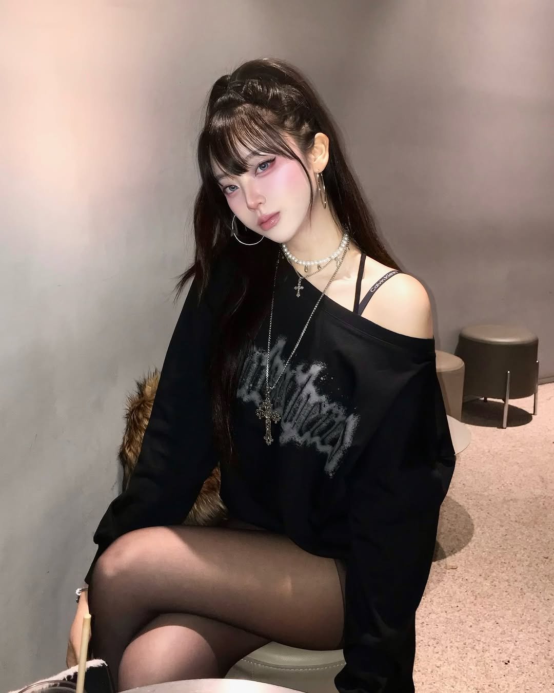 Photo shared by 최윤또 on February 22, 2026 tagging @rockcake_jp. May be an image of one or more people, hair, top, tights, fishnet stockings, sweater, miniskirt and text.