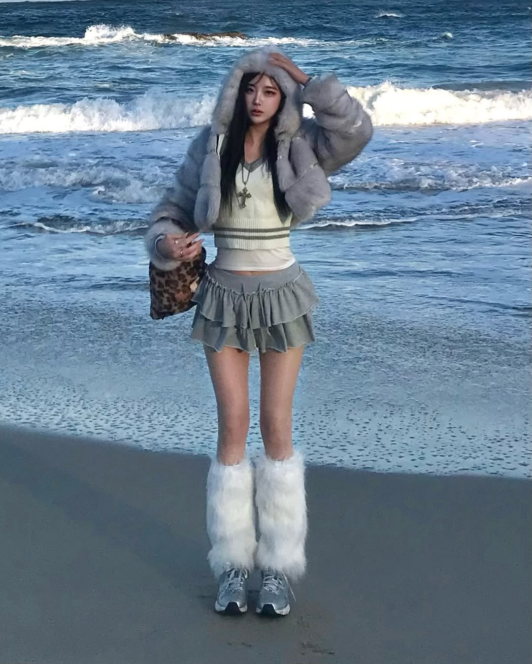 Photo by 최윤또 on January 01, 2026. May be an image of fur coat, miniskirt, fishnet stockings, headdress, glasses and text.