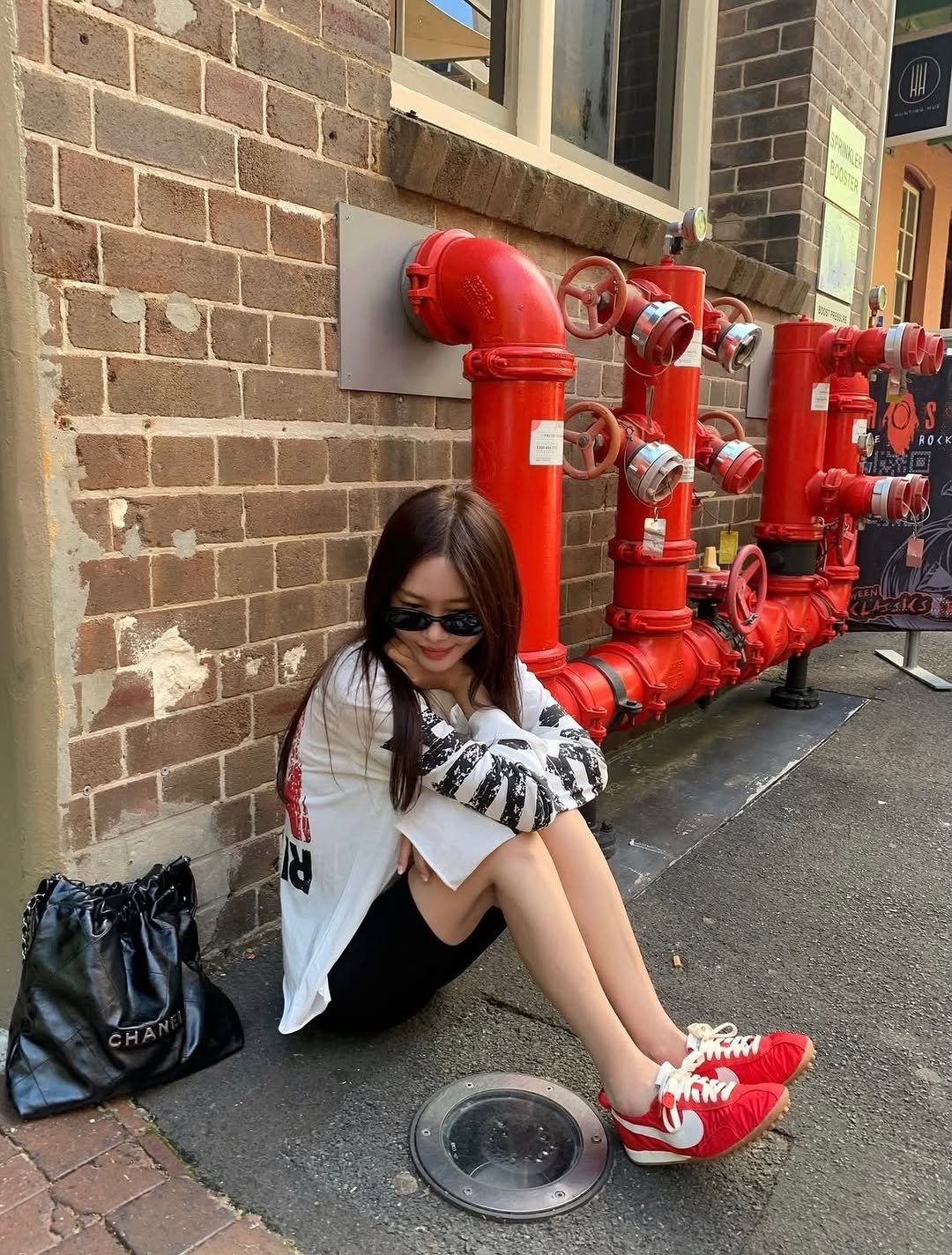 Photo by Kim Yoon on March 03, 2026. May be an image of checker board, slingback shoes, brick wall and text.