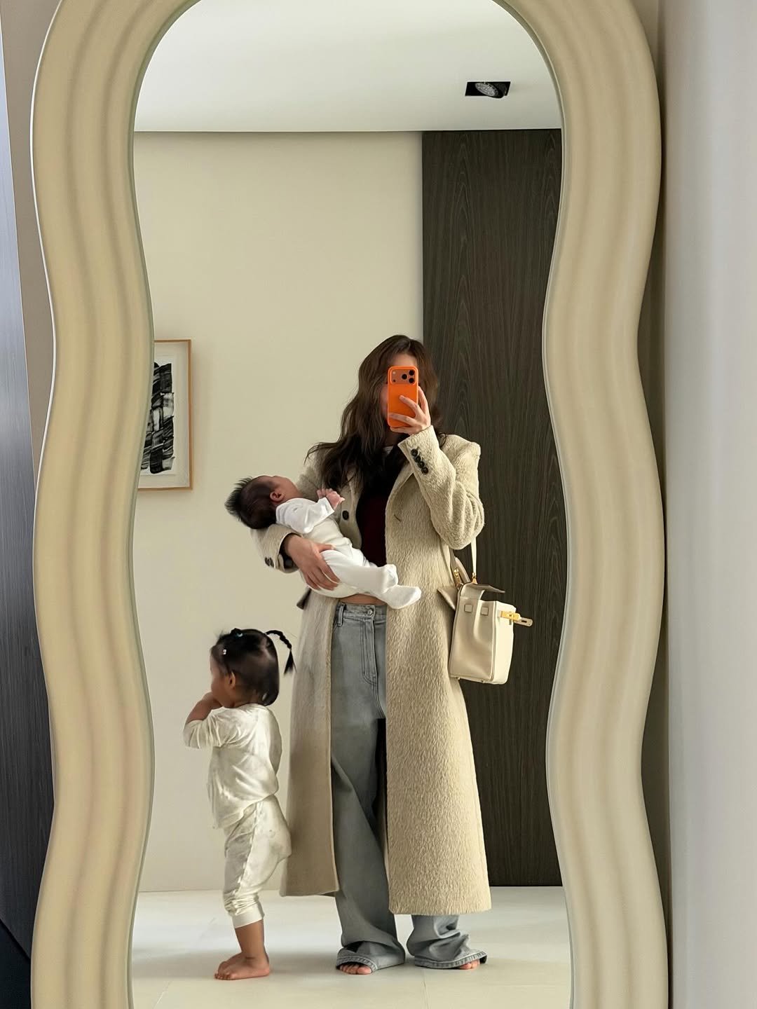Photo by 지윤미 on December 17, 2025. May be an image of baby, mirror and text.
